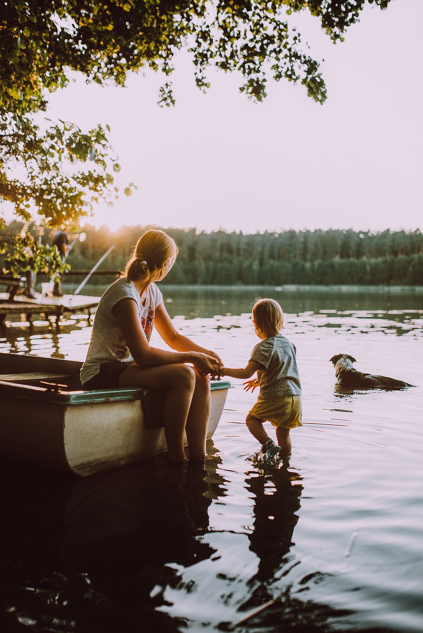 parent and child holding hands in nature